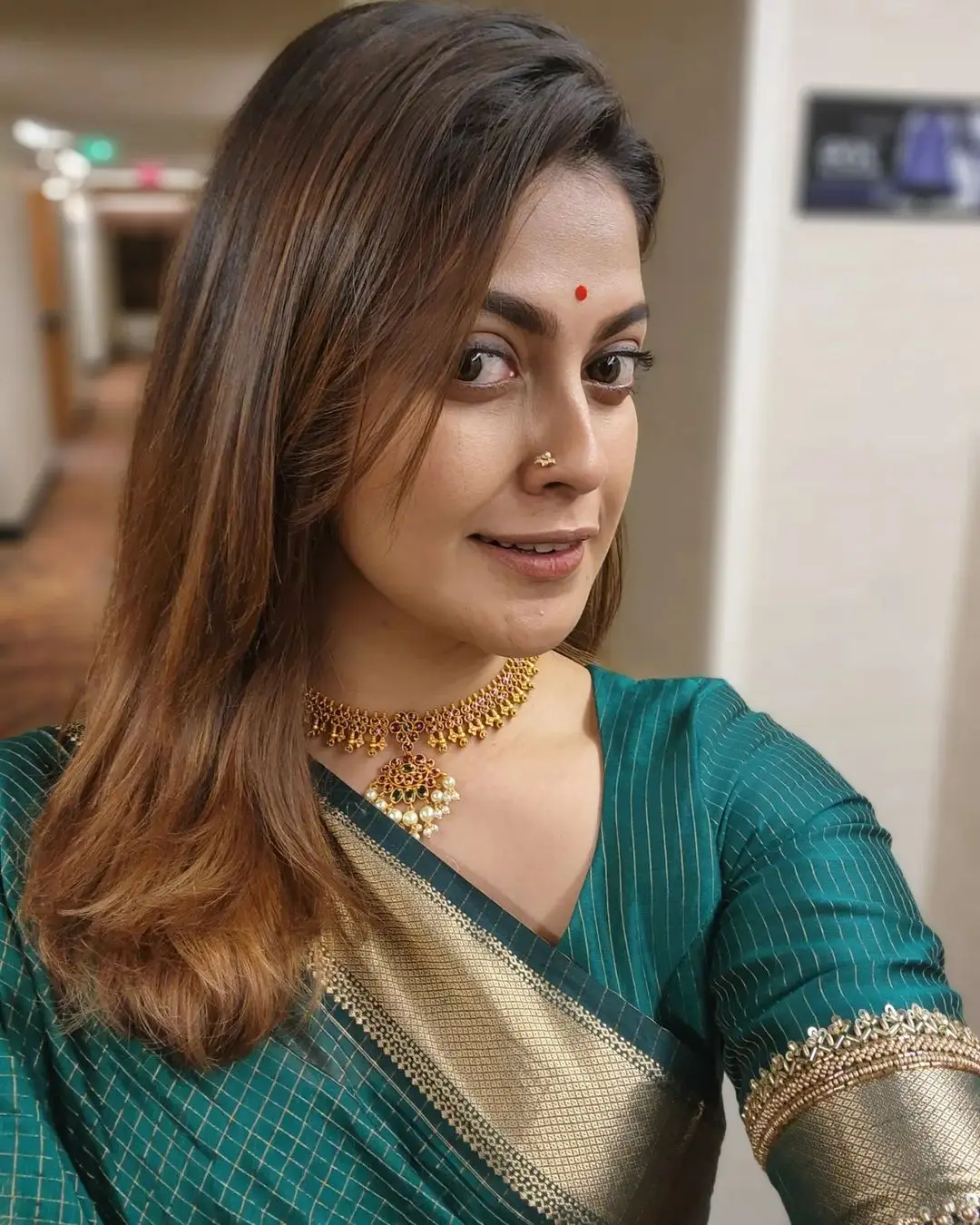 Anusree Nair Wearing Beautiful Earrings Jewellery Green Saree Blouse